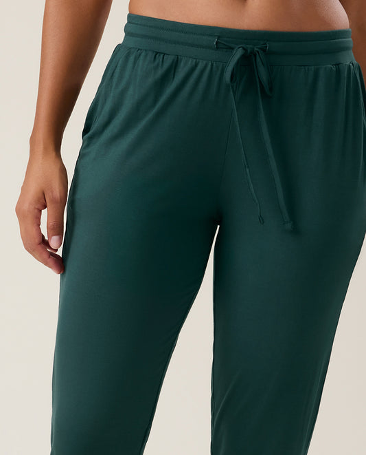 Person wearing dark green joggers
