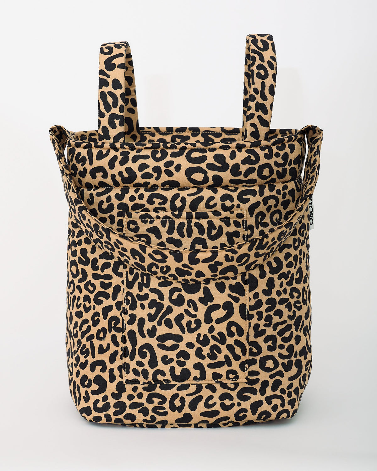Stroller Party™ Bucket Bag in Leopard is sitting upright on surface on a beige background.