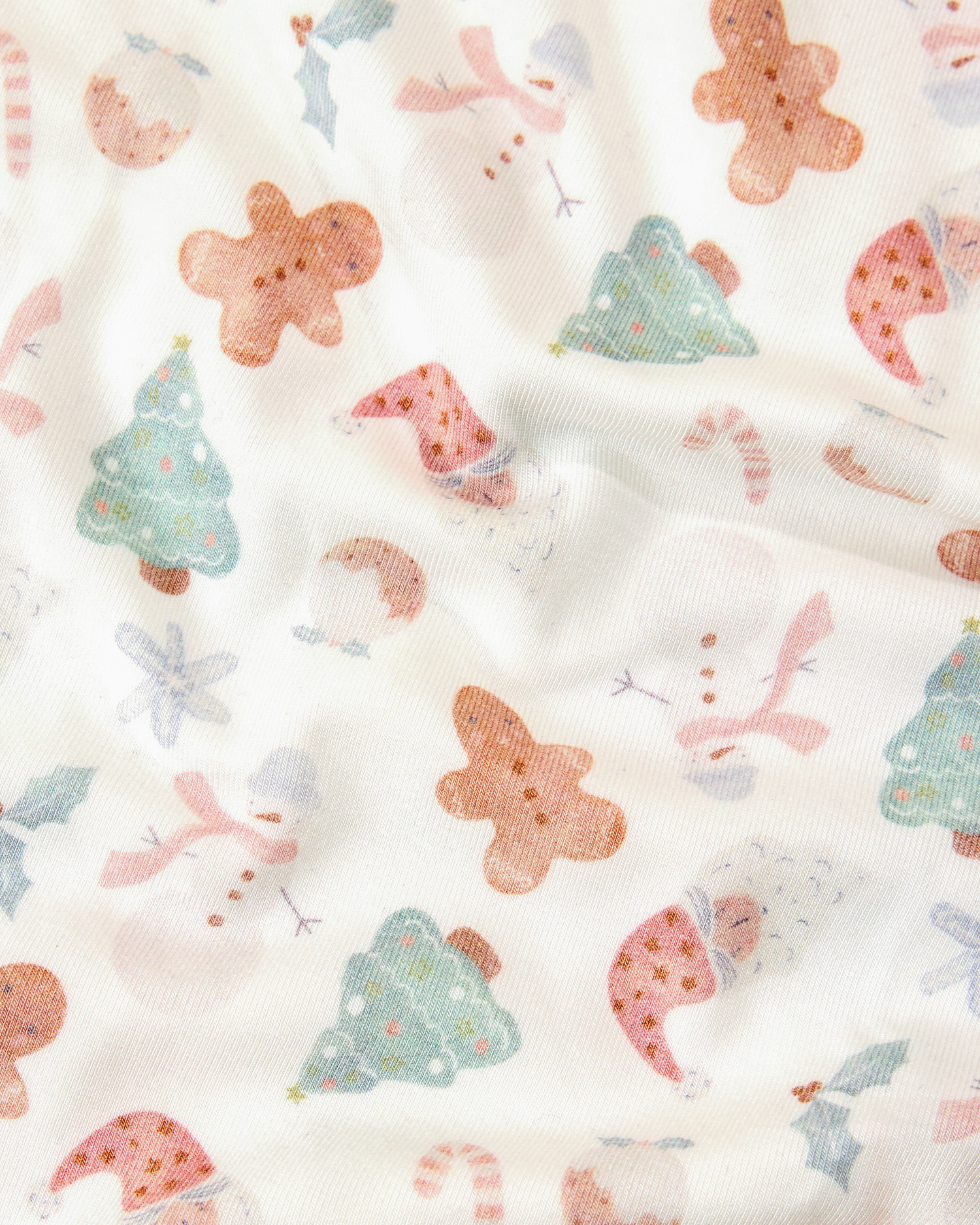 Close up of the Cozy Bamboo Baby Gown & Hat in Cozy Holiday pattern - gingerbread men, Christmas trees, candy canes, Santa, snowmen