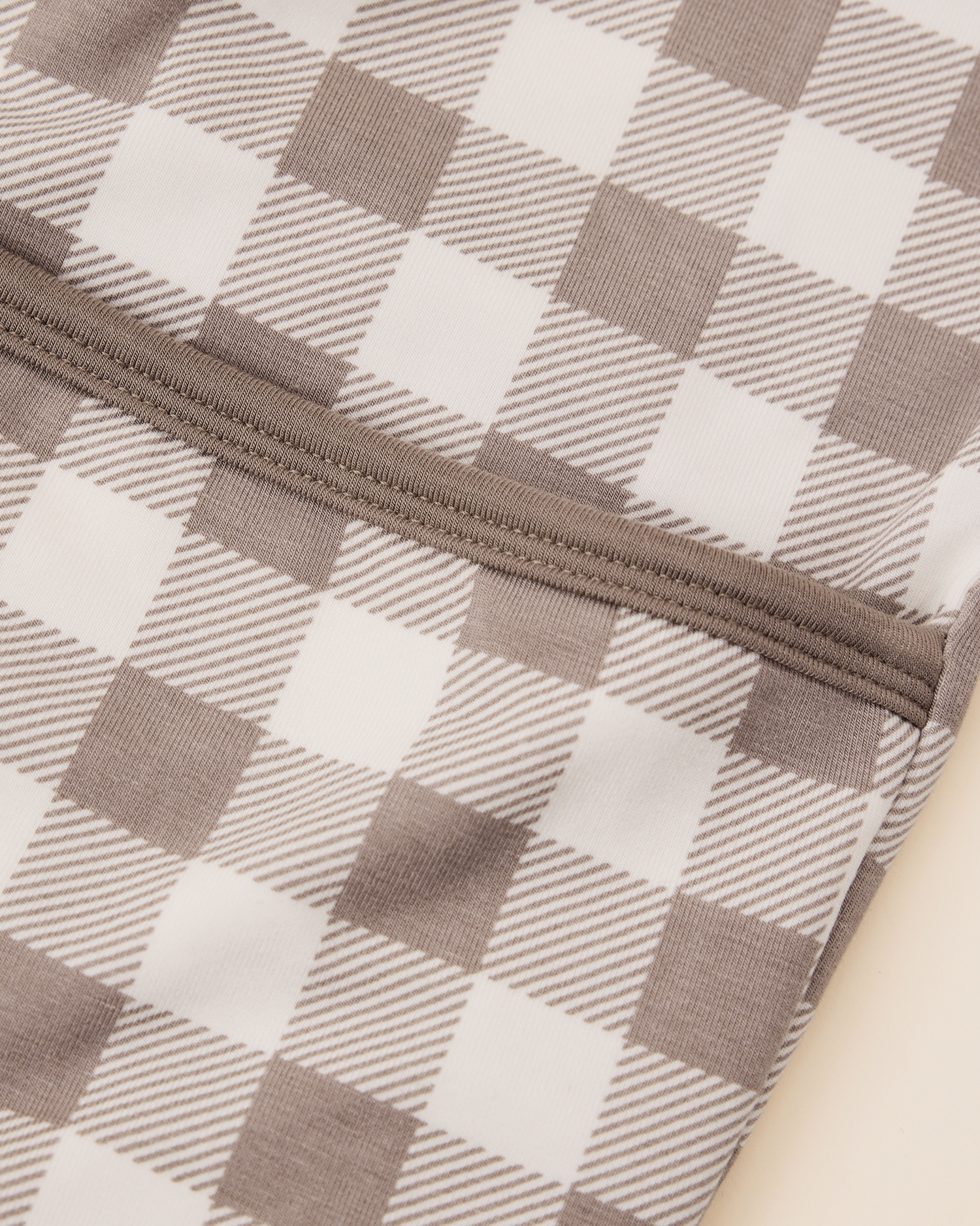 Close-up of the Cozy Bamboo Baby Gown & Hat in Taupe Gingham checkered fabric showing foldover detail