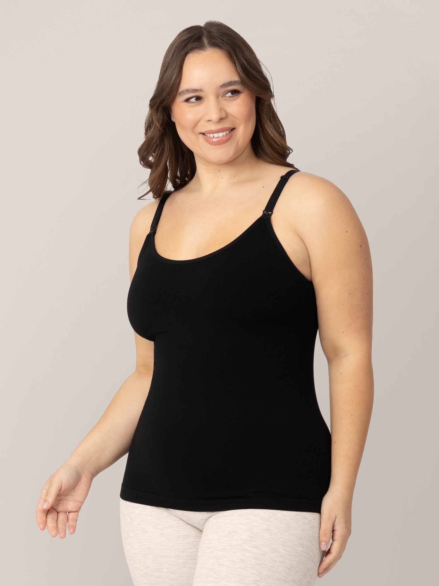 Model turned slightly wearing the Sublime® Bamboo Maternity & Nursing Camisole in Black