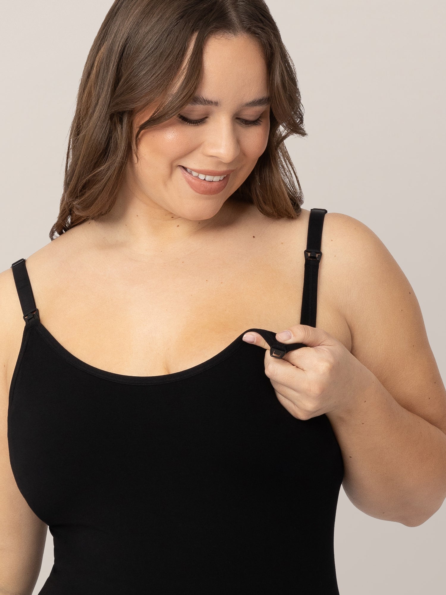 Model showing the easy clip down nursing access on the Sublime® Bamboo Maternity & Nursing Camisole in Black