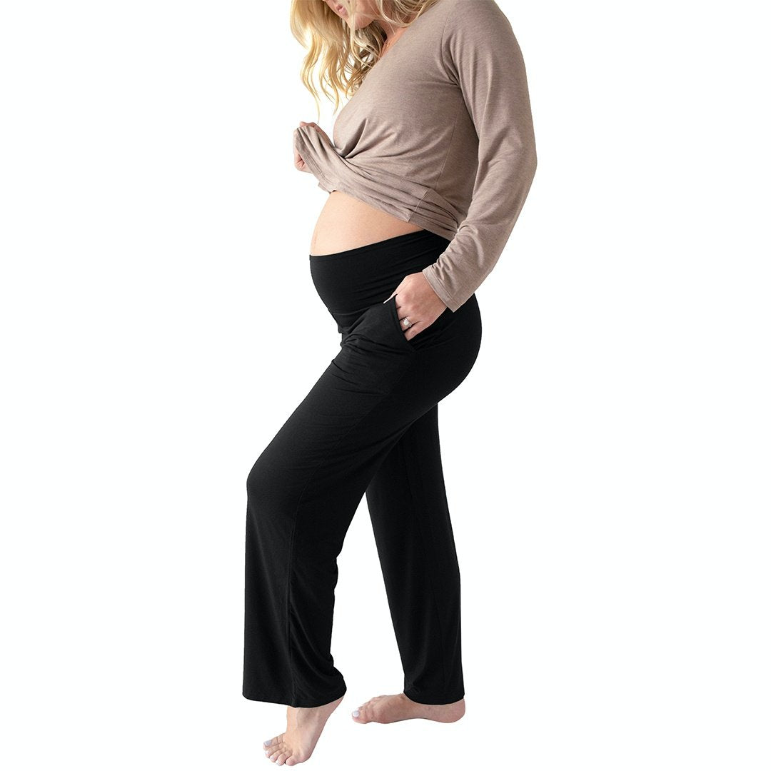 Model wearing the Bamboo Maternity & Postpartum Lounge Pant in Black with her leg popped.