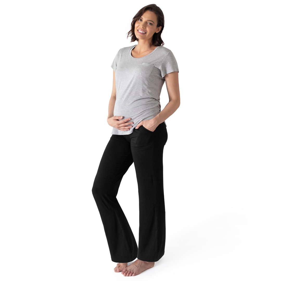 Model wearing the Bamboo Maternity & Postpartum Lounge Pant in Black with her hand in the pocket. @model_info:Alizee is 5'10" and wearing a Medium.