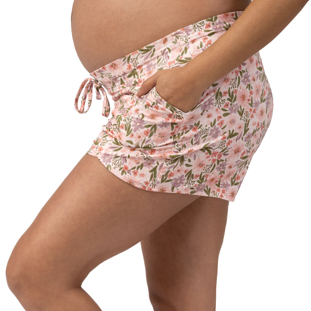 Side view of a pregnant model wearing the Bamboo Maternity & Postpartum Lounge Short in Blush Floral