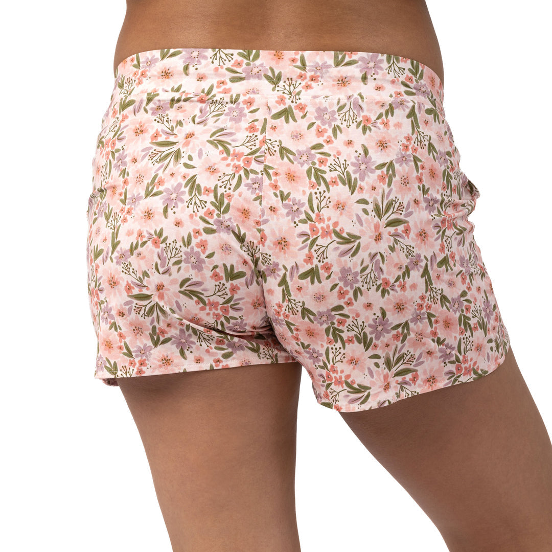 Back view of a pregnant model wearing the Bamboo Maternity & Postpartum Lounge Short in Blush Floral