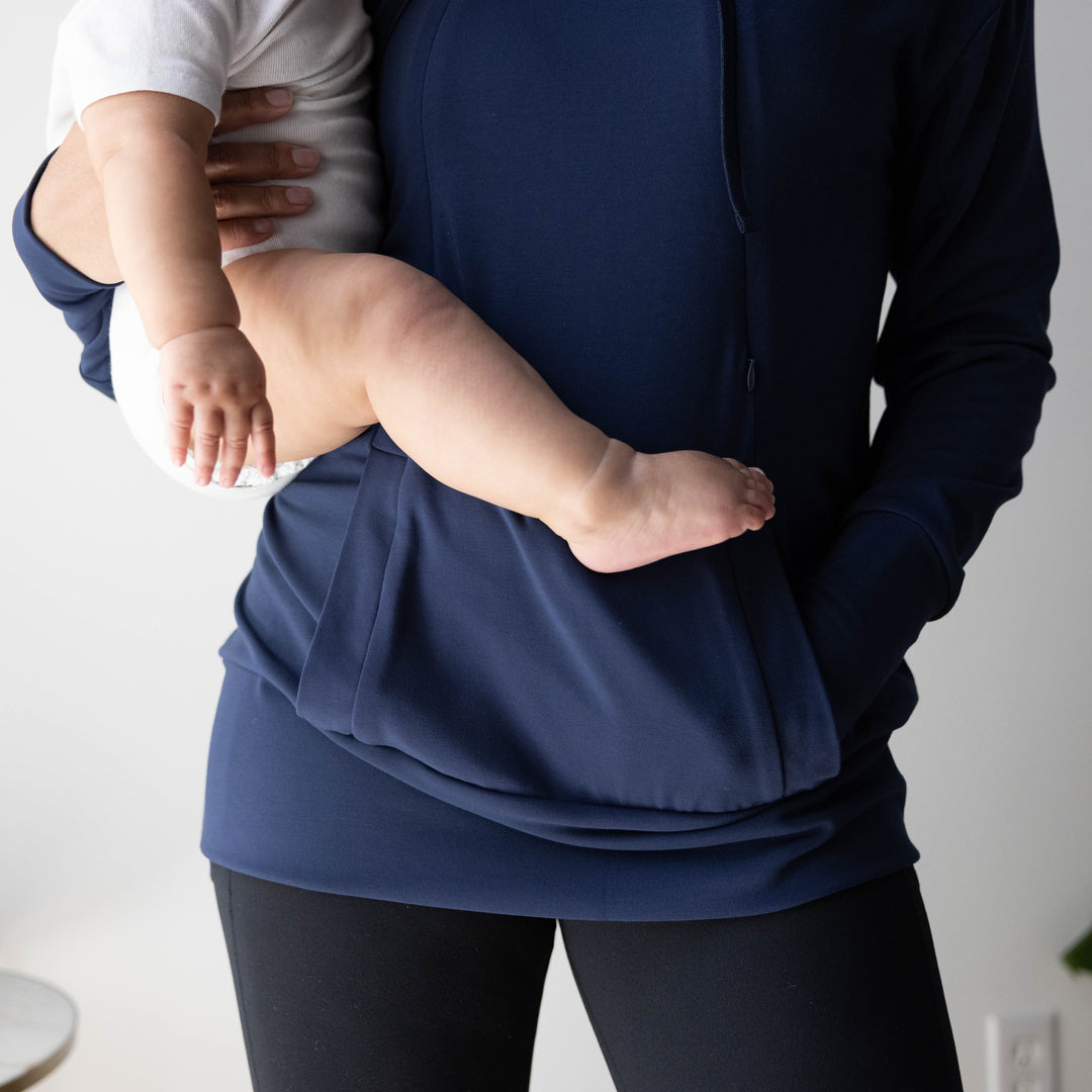 Model with her baby on her hip wearing the Bamboo Nursing Hoodie in Navy