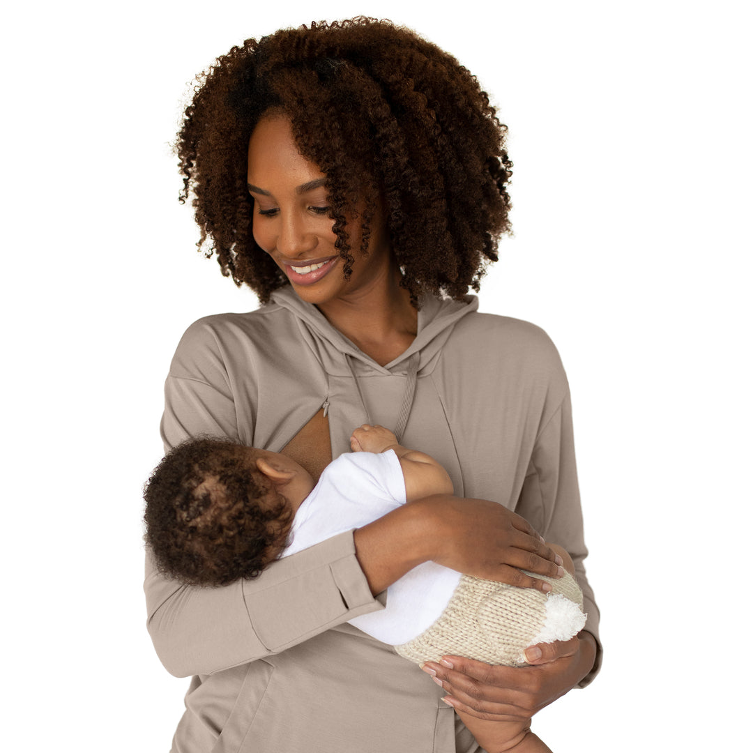 Model breastfeeding her baby while wearing the Bamboo Nursing Hoodie in Stone Taupe
