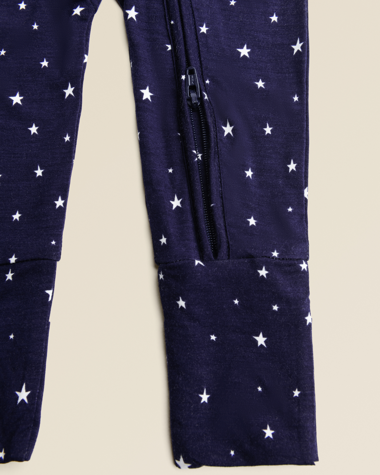 Close-up of zipper detail on Bamboo Baby Pajamas in Navy Stars