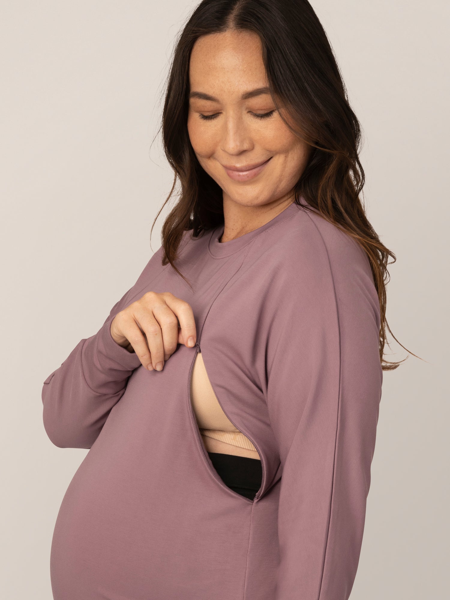 Close up view of pregnant model wearing the Bamboo Maternity & Nursing Crew Neck Sweatshirt in Twilight, showing nursing access.