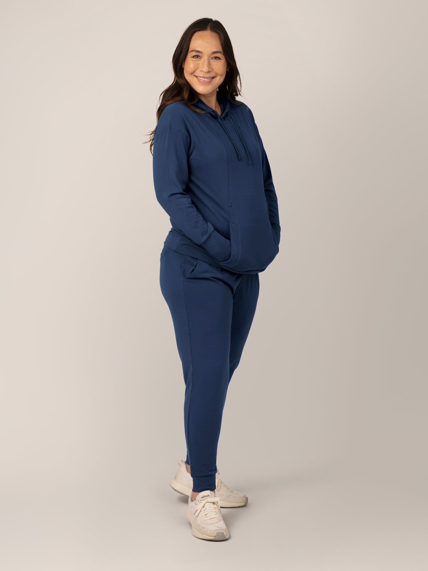 Full body view of model wearing the Bamboo Maternity & Nursing Hoodie in Navy, paired with matching Bamboo Maternity & Postpartum Jogger