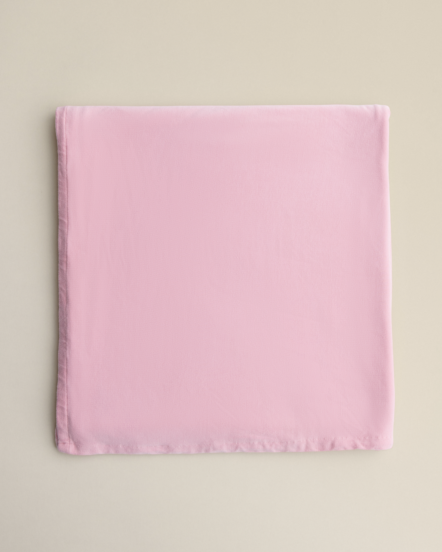 Bamboo Swaddle Blanket in Light Mauve on a beige background