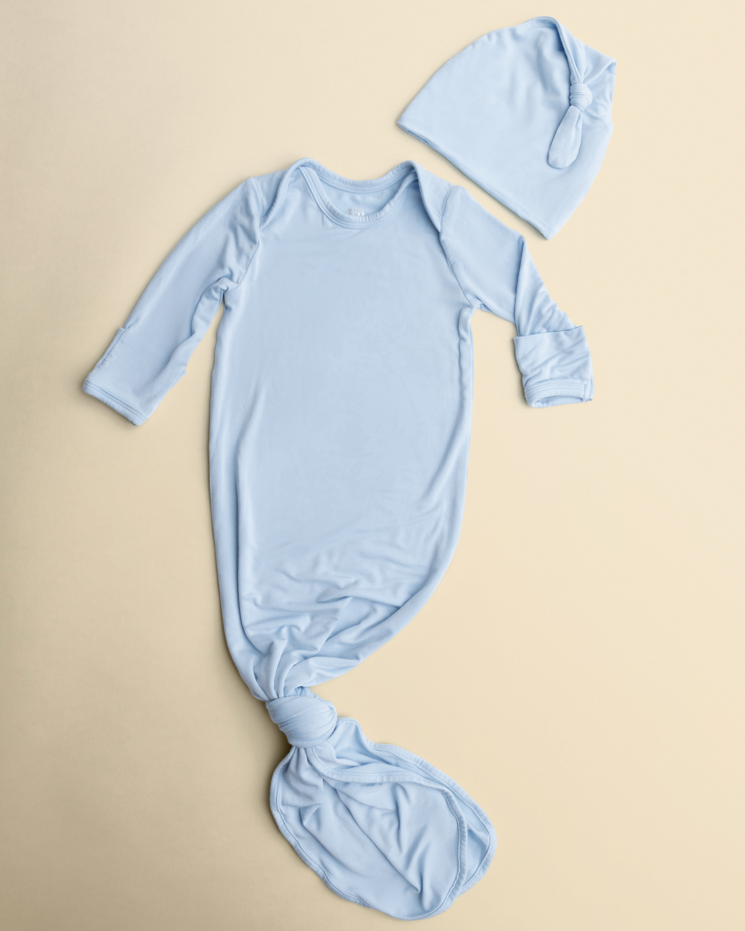 Bamboo Knotted Baby Gown in French Blue on a beige background