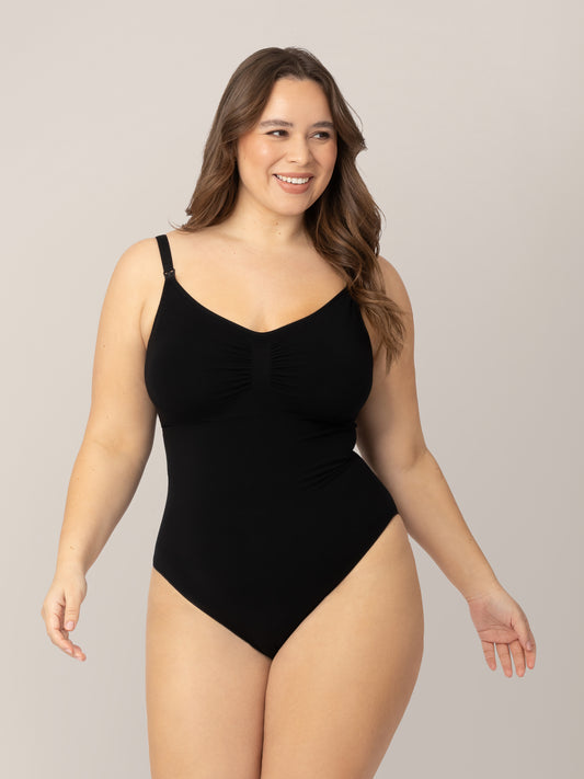 Model wearing the Sublime®️ Bamboo Maternity & Nursing Bodysuit in Black  with her hands at her sides. @model_info:Venezia is wearing a Large.