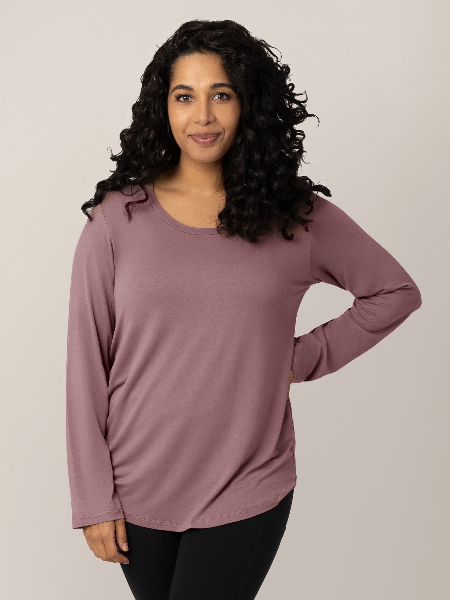 Model wearing the Bamboo Maternity & Nursing Long Sleeve T-shirt with her hand on her hip. @model_info:Zakeeya is wearing a Small.