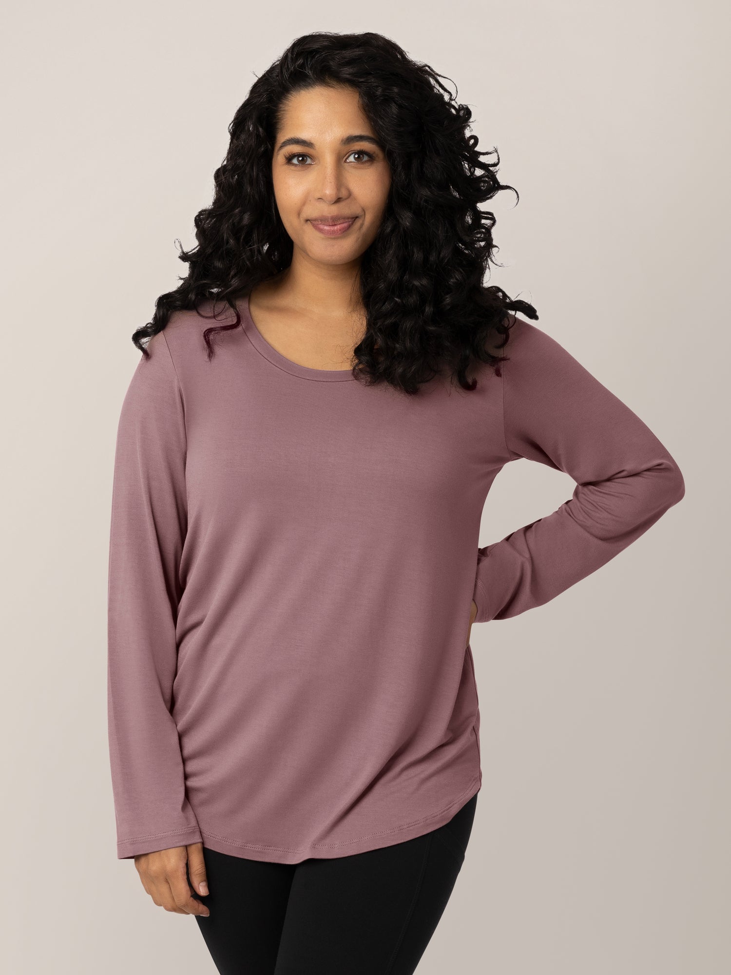 Model wearing the Bamboo Maternity & Nursing Long Sleeve T-shirt with her hand on her hip. @model_info:Zakeeya is wearing a Small.