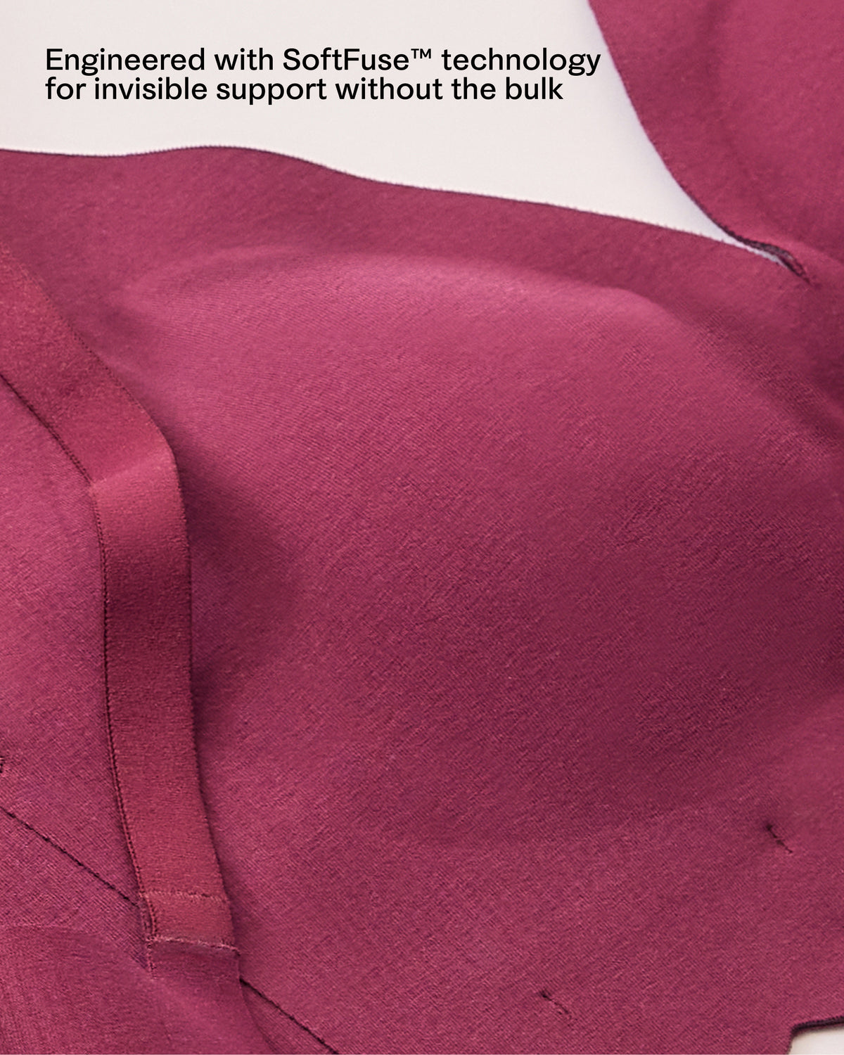 Close-up of scalloped edge of the BareBond™ Cotton Maternity & Nursing Plunge Bra in Garnet reading 'Engineered with SoftFuse™ technology for invisible support without the bulk'.
