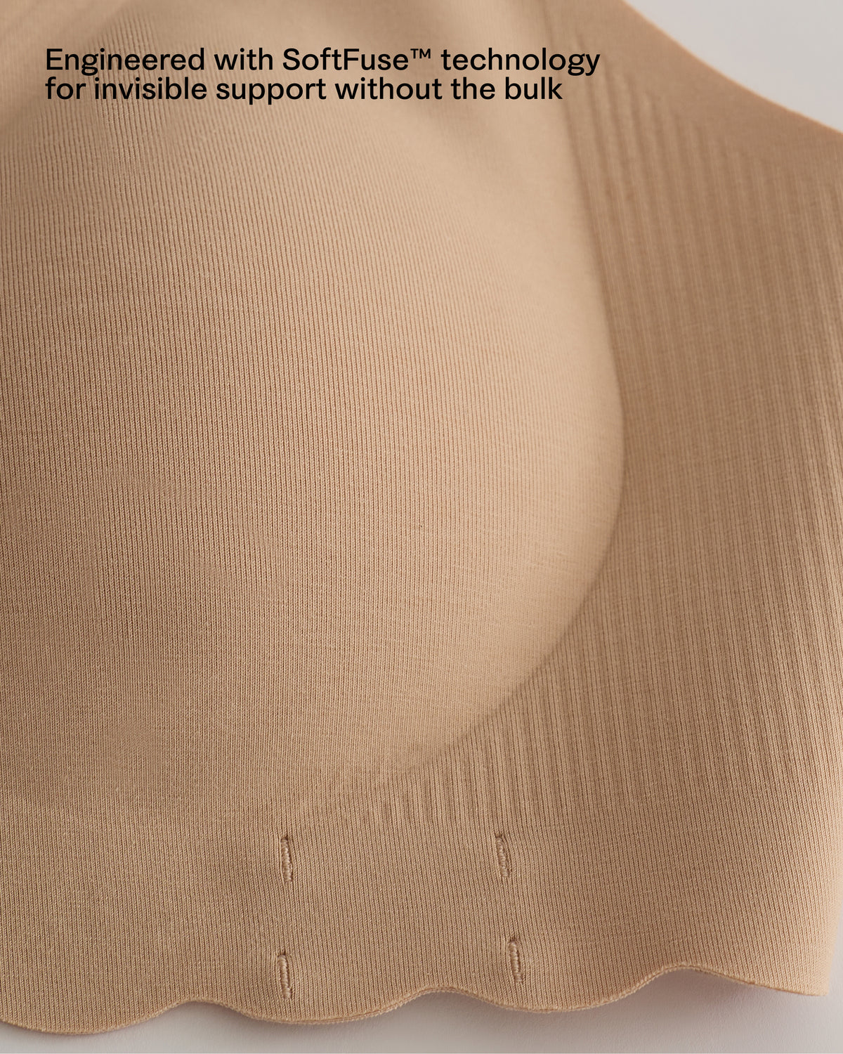 Close-up of scalloped band of the BareBond™ Cotton Maternity & Nursing Bralette in Black with text reading 'Engineered with SoftFuse™ technology for invisible support without the bulk'.