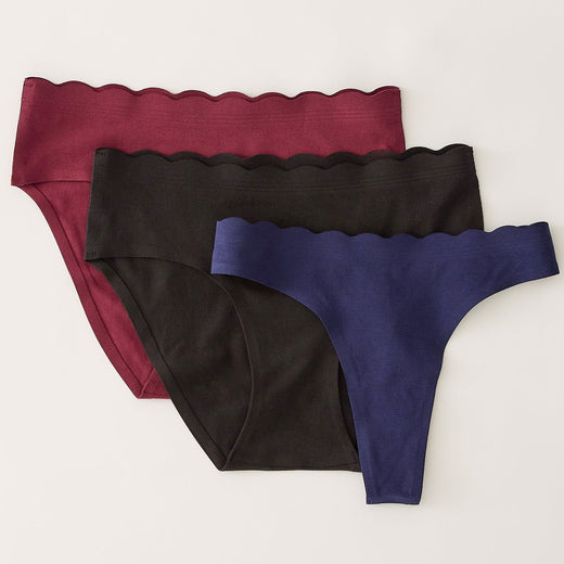 BareBond™ Cotton Maternity & Postpartum Brief in Garnet, Hipster in Black and Thong in Coastal Navy. Laid flat on a beige background.