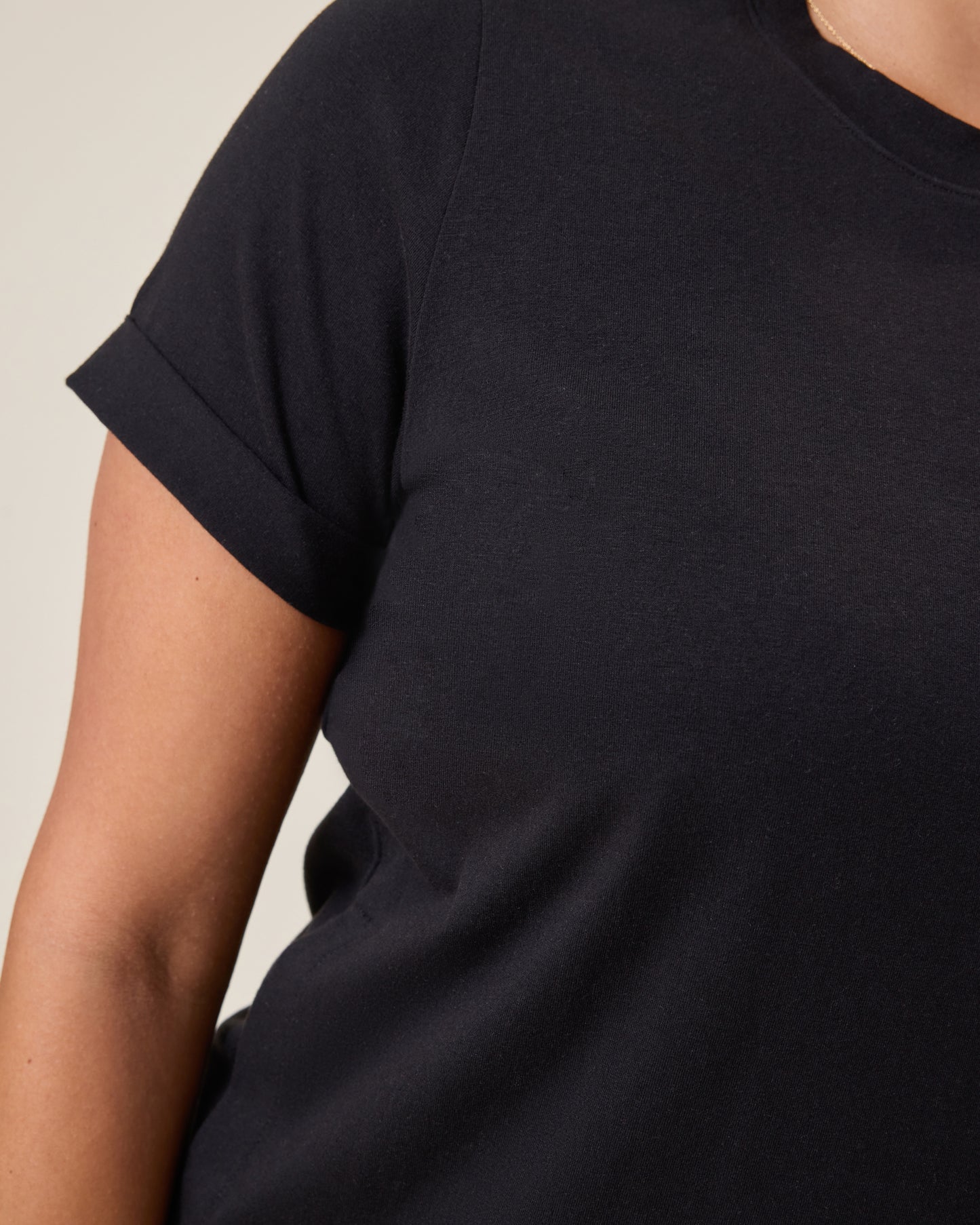 Close up of fabric and sleeve detail on the Classic Nursing T-shirt Mini Dress worn by a person