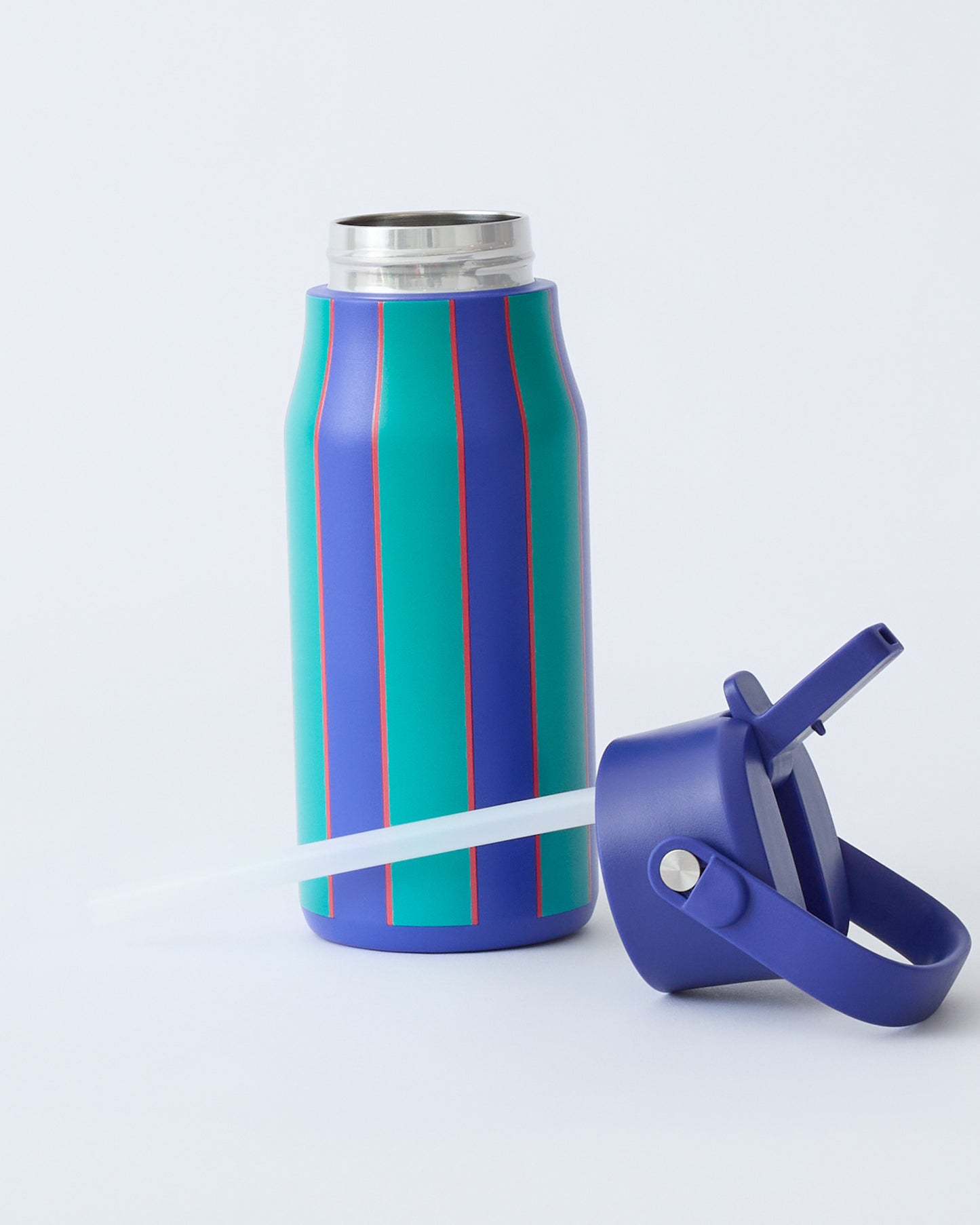Cool Kid Water Bottle in Navy & Green Stripe with lid off and laying with straw in front, on beige background.