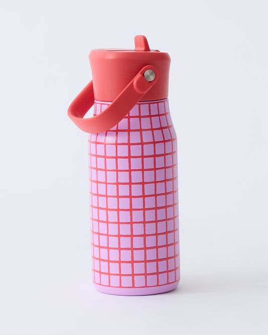 Cool Kid Water Bottle in Orchid Grid on a beige background.