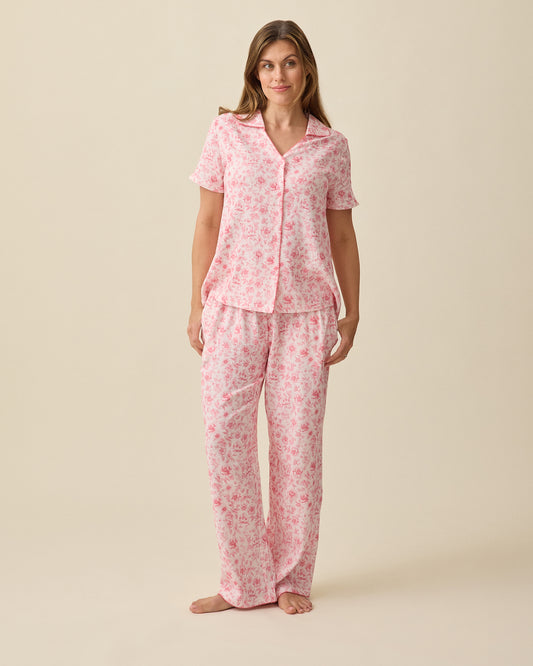 Model wearing Cotton Bamboo Pajama Set in Pink Toile on a beige background. @model_info:Brittany is 5'7" and wearing a Small.
