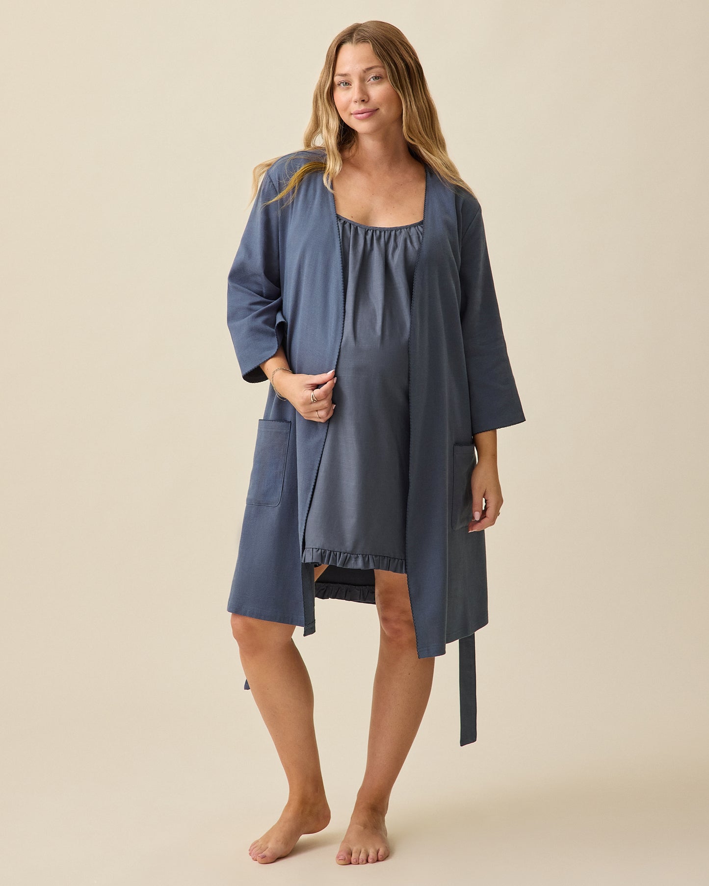 Model wearing Cotton Bamboo Robe in Midnight Blue on a beige background