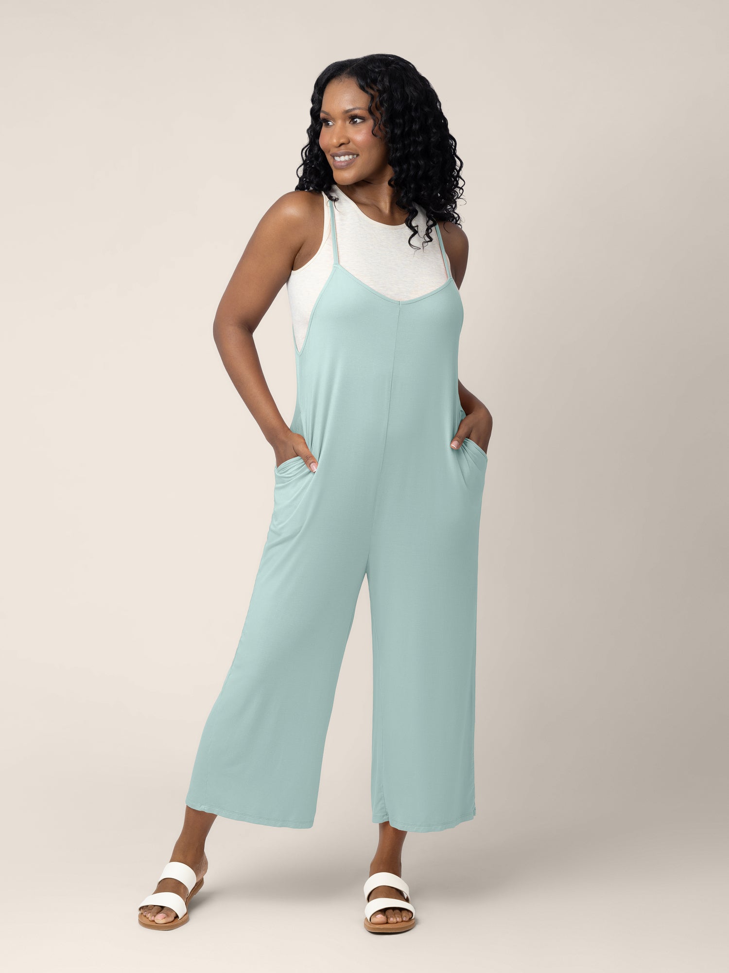 A model wearing the Charlie Maternity & Nursing Romper in Dusty Blue Green @model_info:Rashé is 5'6" and wearing a Small.