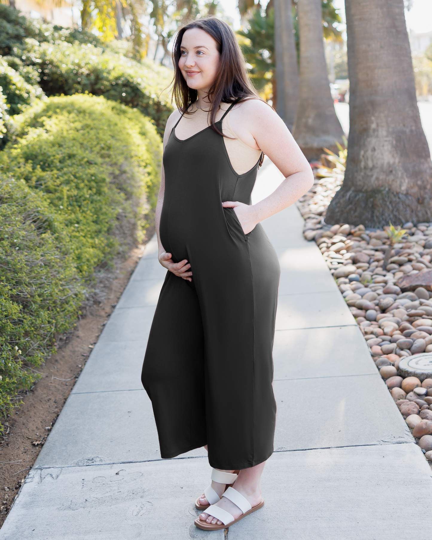 Model wearing the Charlie Maternity & Nursing Romper in Black @model_info:Madi is 5'6" and wearing a Medium.