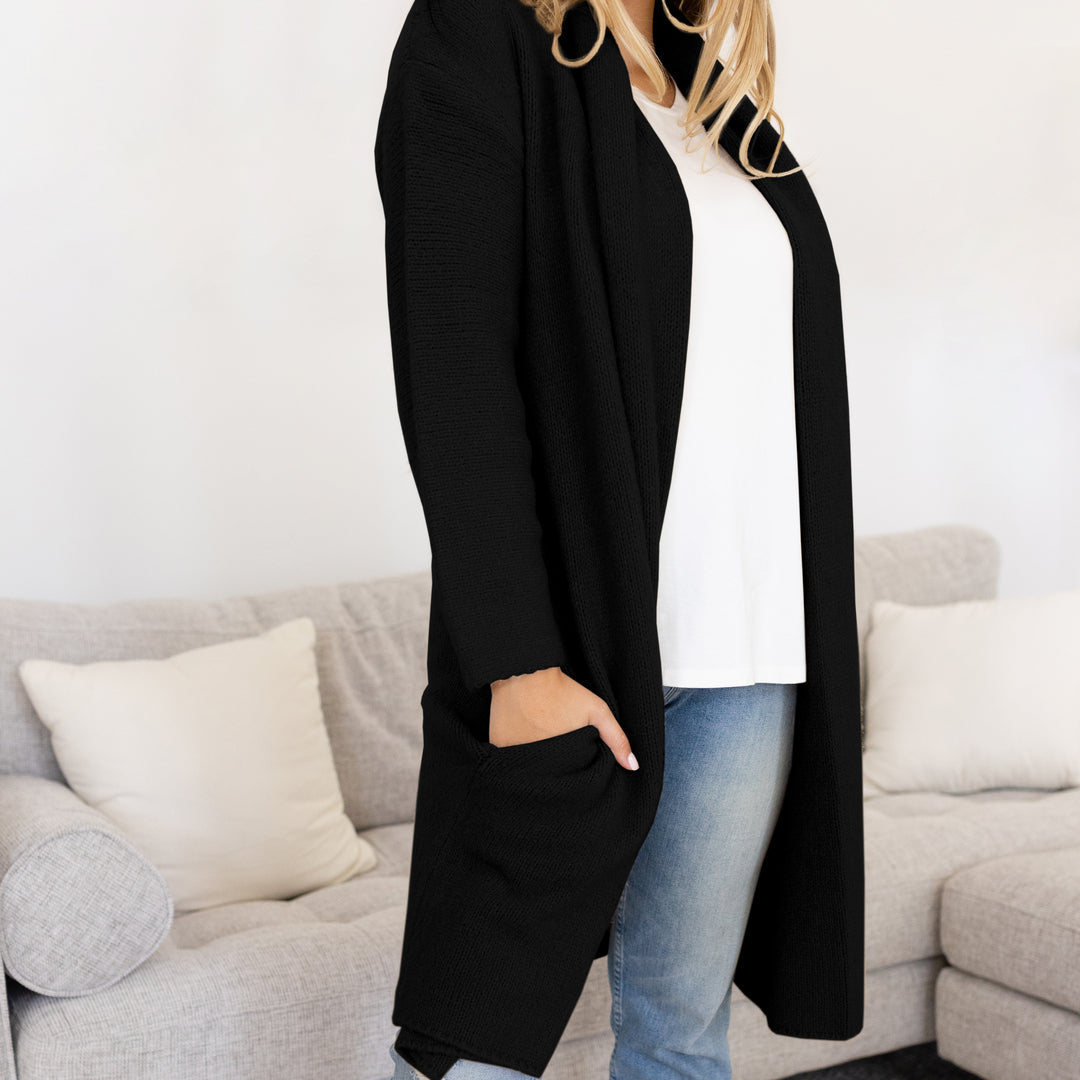 Model wearing the Chloe Cardigan Sweater in Black @model_info:Raine is wearing a M/S.