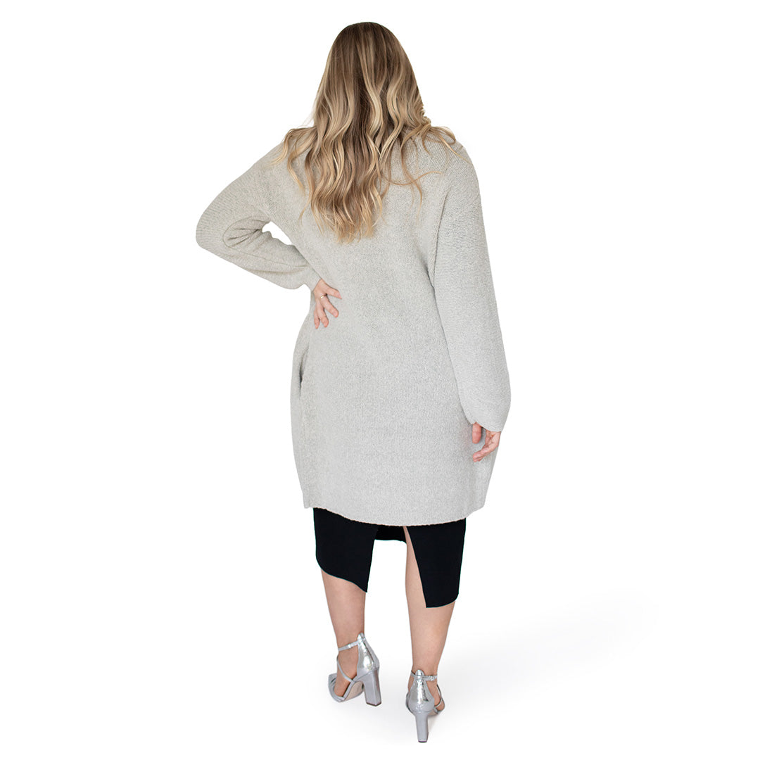 Back view of a pregnant model wearing the Chloe Cardigan Sweater in Grey Heather