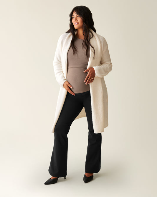 Woman wearing the Maternity Ponte Flare Pant, paired with the Chloe Cardigan and Ecru and a taupe top@model_info:Zoe is 5'7" and wearing a Medium.