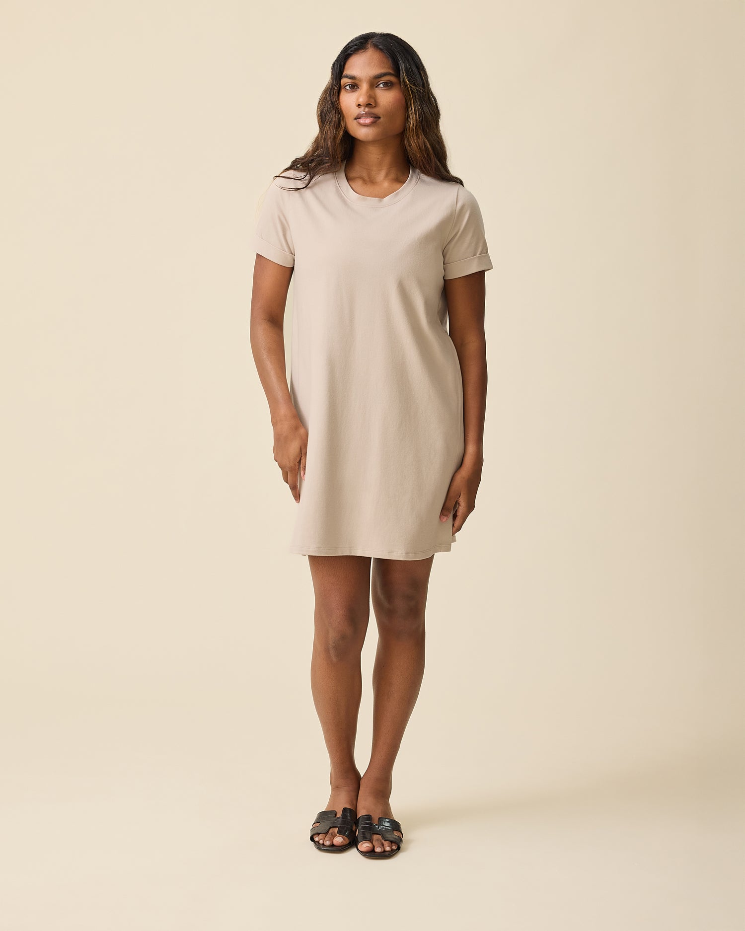 Woman wearing the Classic Nursing T-shirt Mini Dress in Sand@model_info:Sahana is 5'7" and wearing a Medium.