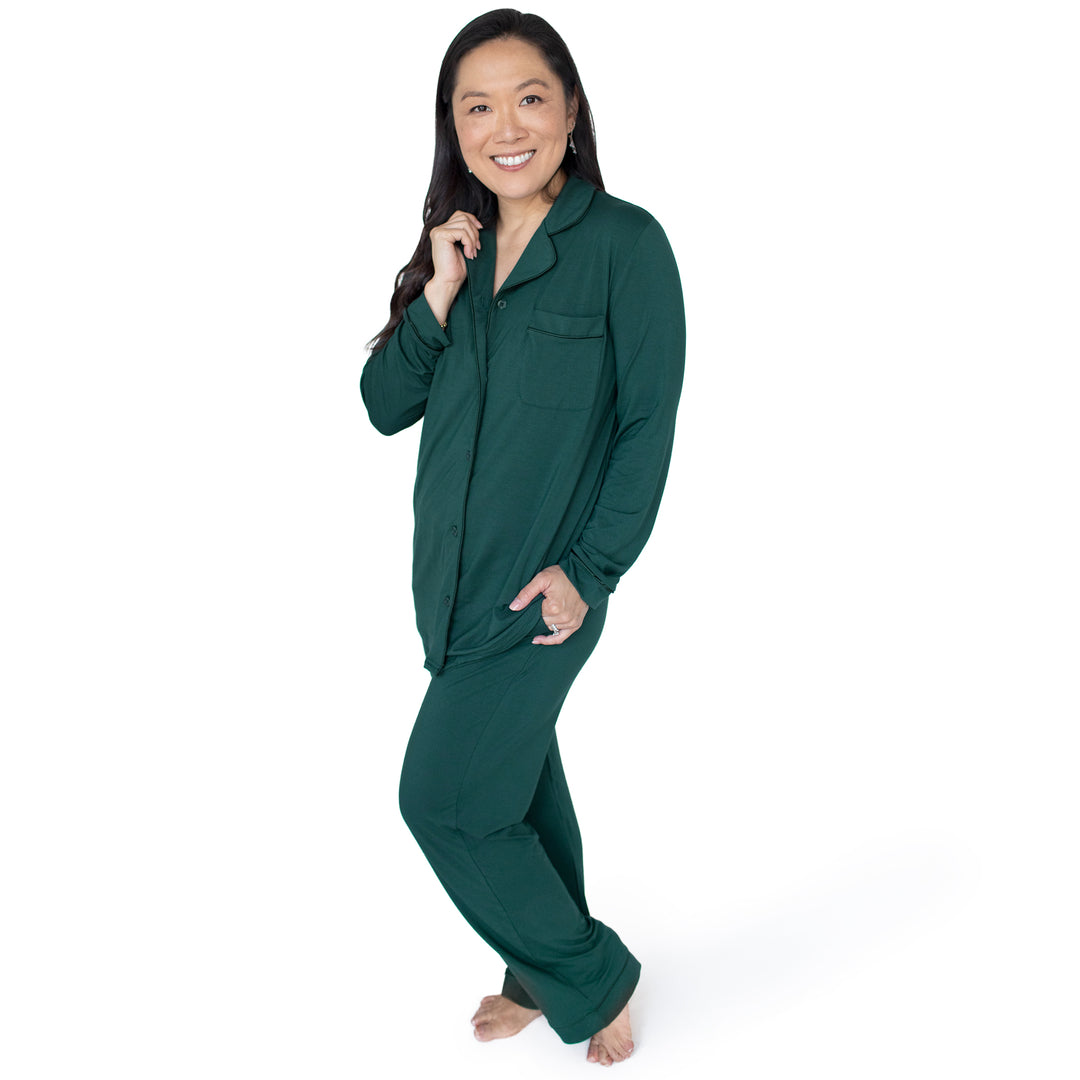 Model wearing the Clea Bamboo Long Sleeve Pajama Set in Evergreen with her hand on her collar.