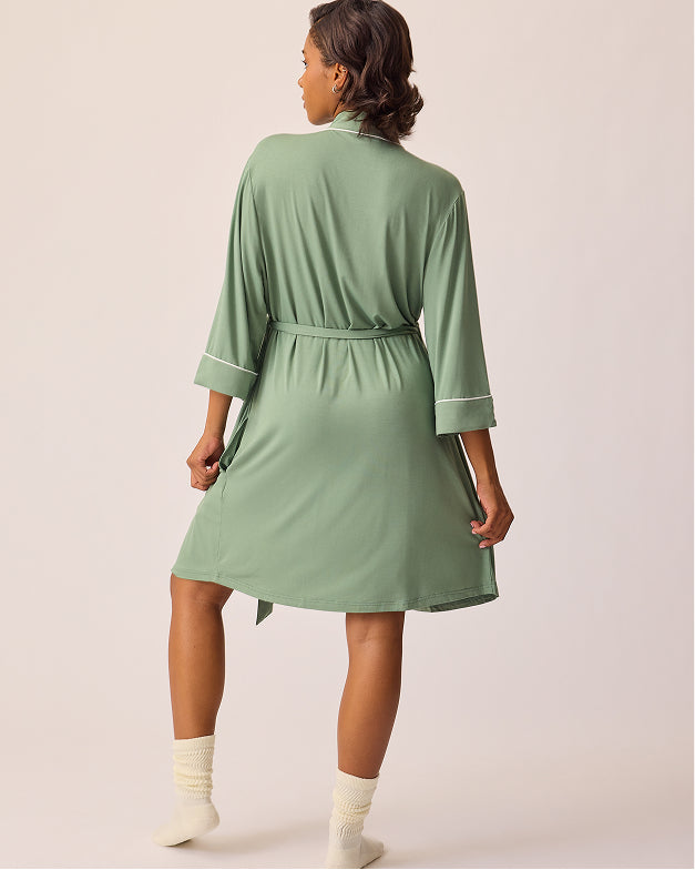 Back view of model wearing Clea Bamboo Robe in Sage and Non-Slip Slouchy Socks in Cream on a beige background.