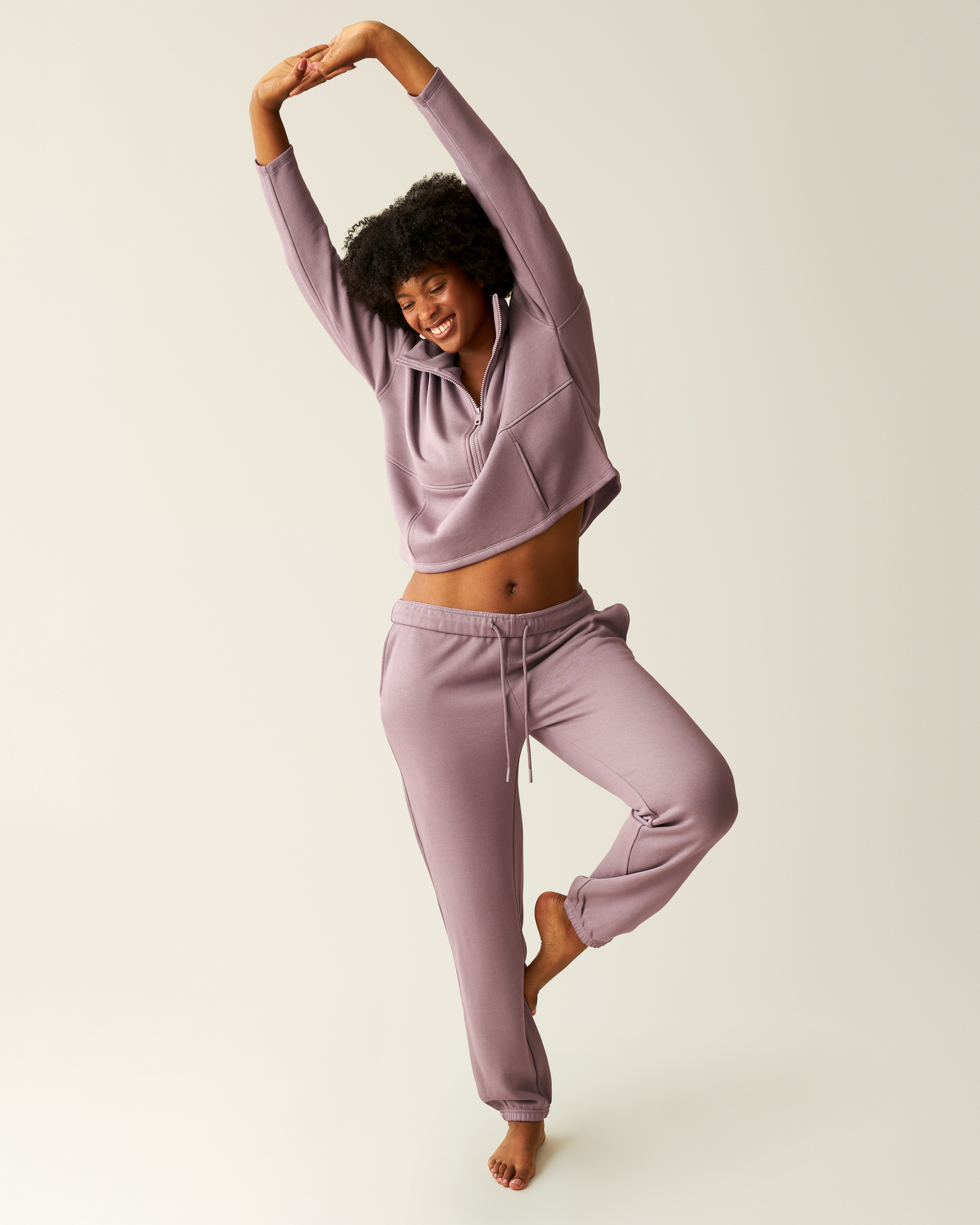 Woman wearing the Cloud Fleece Jogger in Dusty Mauve paired with Cloud Fleece Half-Zip Pullover