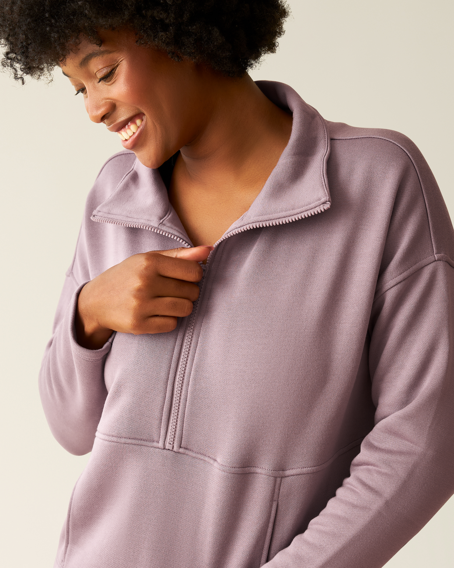Woman wearing the Cloud Fleece Half Zip Pullover in Dusty Mauve