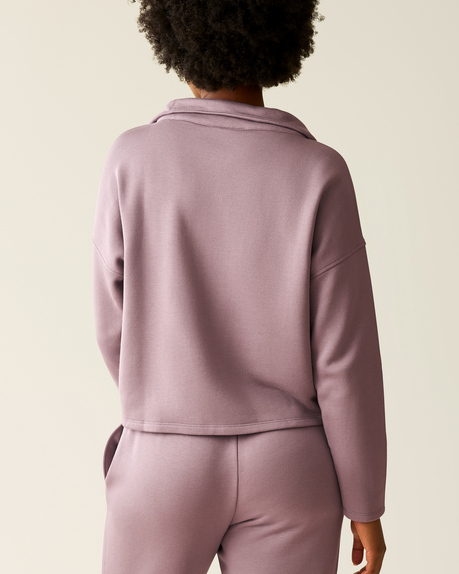 Back of woman wearing the Cloud Fleece Half Zip Pullover in Dusty Mauve