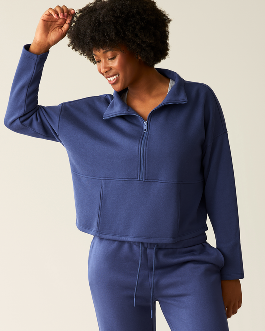 Woman wearing the Cloud Fleece Half Zip Pullover in Deep Blue@model_info:Kyra is wearing a Small.