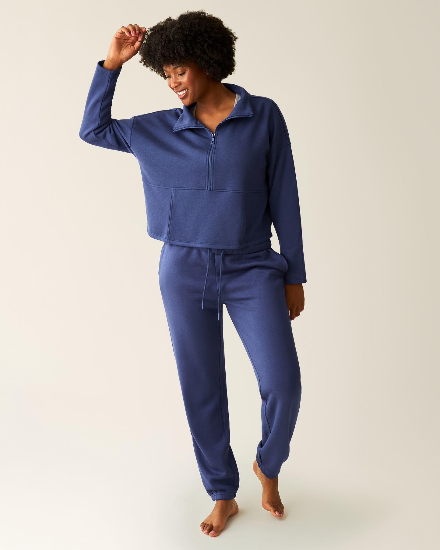 Woman wearing the Cloud Fleece Half Zip Pullover in Deep Blue with matching Cloud Fleece Jogger