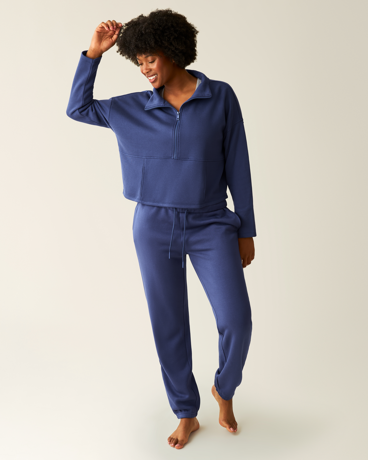 Woman wearing the Cloud Fleece Half Zip Pullover in Deep Blue with matching Cloud Fleece Jogger
