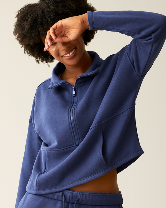 Woman wearing the Cloud Fleece Half Zip Pullover in Deep Blue@model_info:Kyra is wearing a Small.