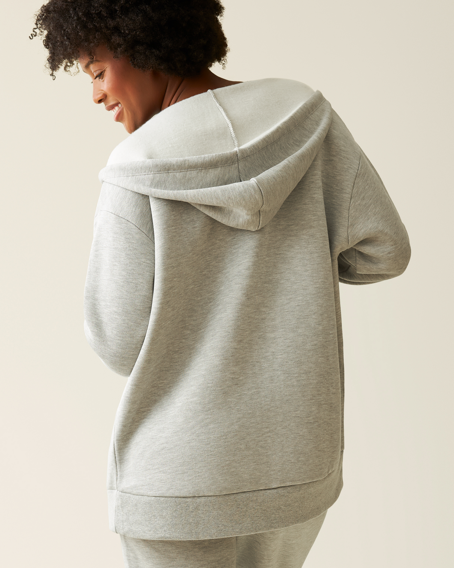Back of woman wearing the Cloud Fleece Oversized Hoodie in Grey Heather 