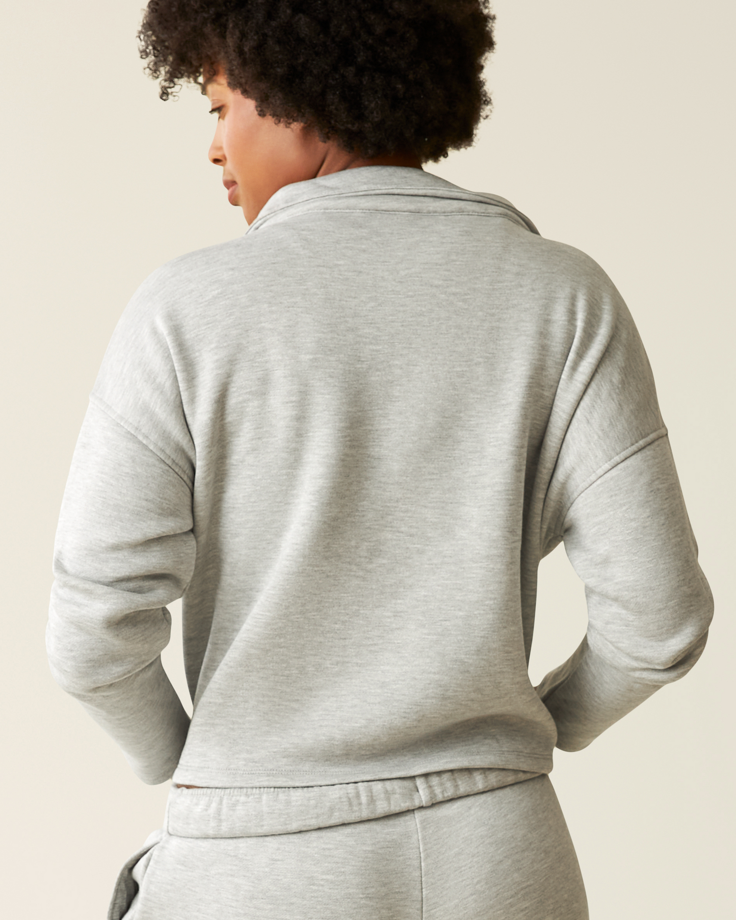 Woman wearing the Cloud Fleece Half Zip Pullover in Grey Heather showing back