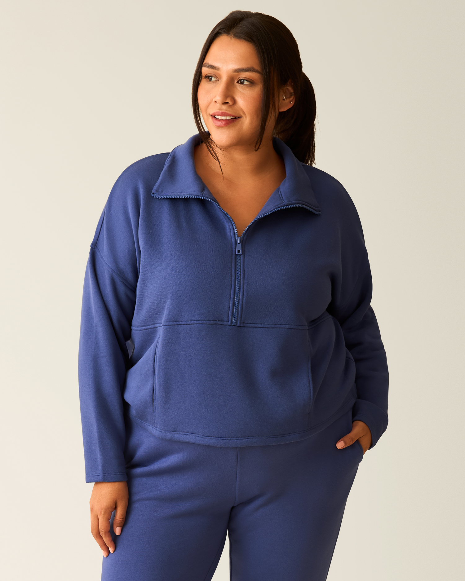 Woman wearing the Cloud Fleece Half Zip Pullover in Deep Blue@model_info:Victoria is wearing a 1X.