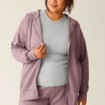 Woman wearing items from the Cloud Fleece collection in Dusty Mauve, paired with a grey shirt