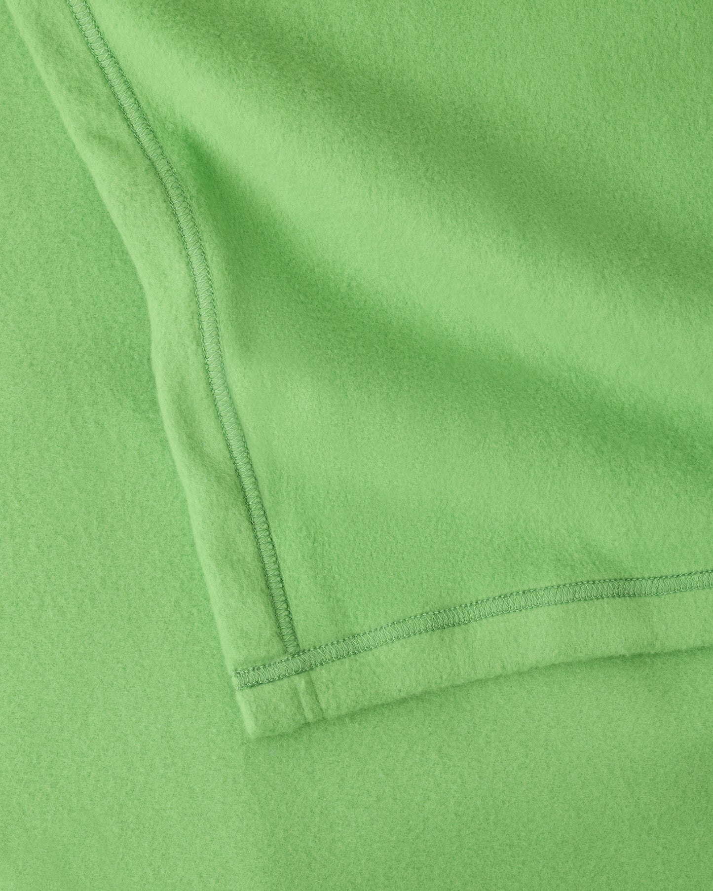 Close up of the soft blanket of the Cool Kid Nap Mat in Blue Apple.