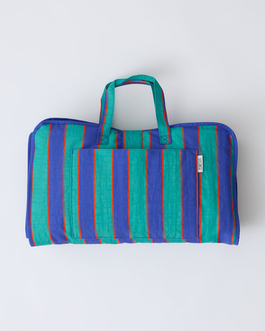 Cool Kid Nap Mat in Navy & Green Stripe on a beige background.