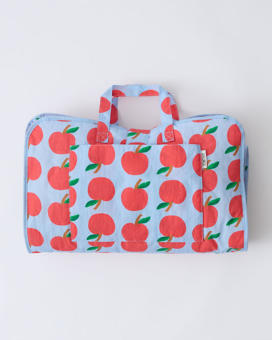 Cool Kid Nap Mat in Blue Apple on a beige background.